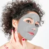 beautiful-young-woman-applying-natural-acne-mask-to-face