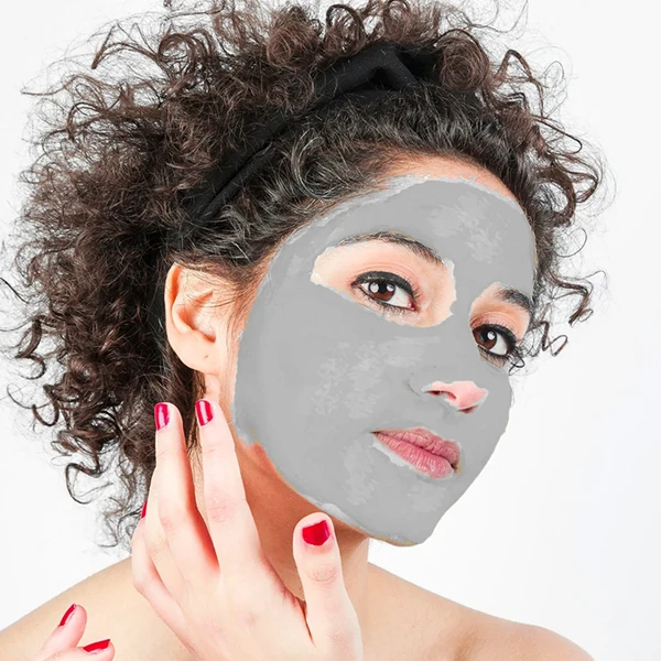 beautiful-young-woman-applying-natural-acne-mask-to-her-face