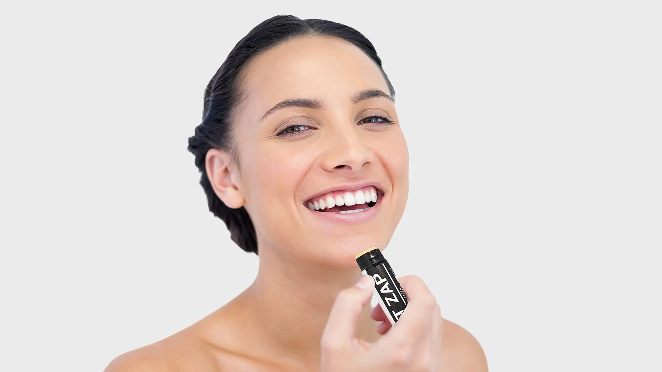 cheerful-young-woman-applying-corum-zit-zap