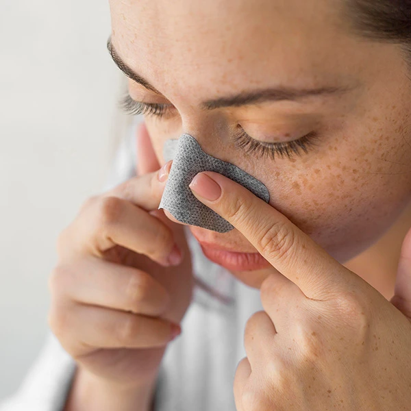 close-up-woman-using-nose-strip-how-to-remove-blackheads-on-nose