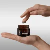 hand-holding-corum-exfoliating-manuka-mud-3ox--jar-probiotics-prebiotics-honey-xylitol-malassezia-safe
