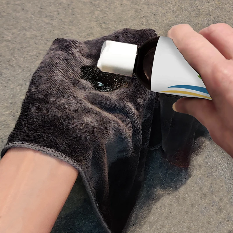 Hand pouring Corum Hydrating Cleanser onto a cloth