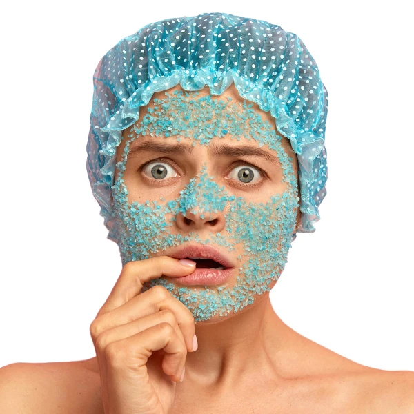 Woman in shower cap with concerned expression with sugar scrub on her face and text, "Is this a good idea?"