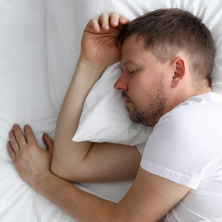 young-caucasian-MAN-sleeping-white-bed